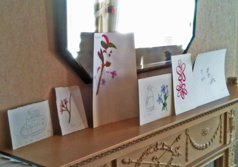 Mantlepiece of paintings