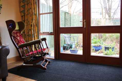 Rocking chair in window