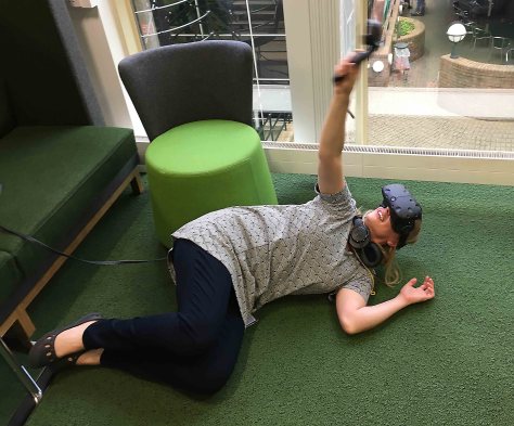 Artist Heidi Hinder immersing herself in a virtual reality experience